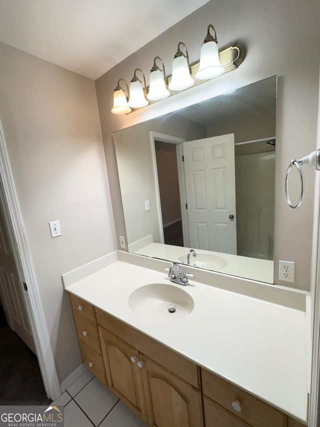 bathroom with vanity and tile patterned floors