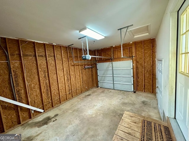 garage featuring a garage door opener