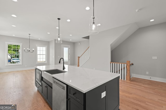 kitchen featuring appliances with stainless steel finishes, recessed lighting, a sink, and light wood-style floors