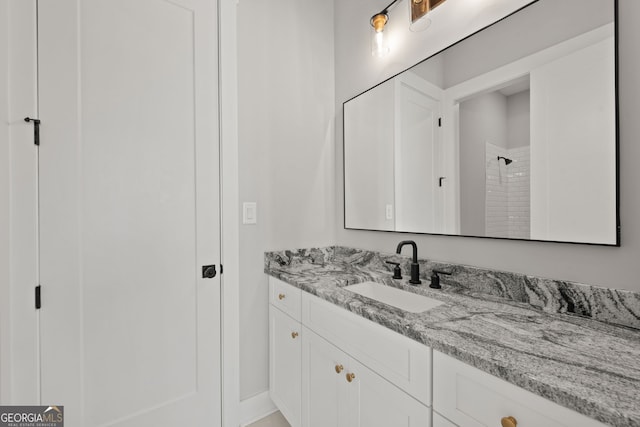 full bathroom with walk in shower and vanity