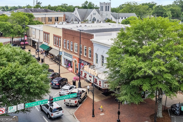 view of building exterior featuring uncovered parking