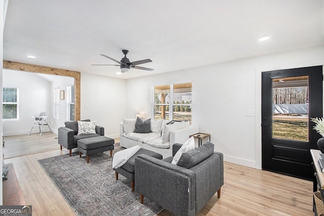 living area with baseboards, ceiling fan, recessed lighting, and light wood-style floors