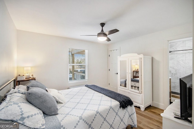 bedroom with light wood-style floors and ceiling fan