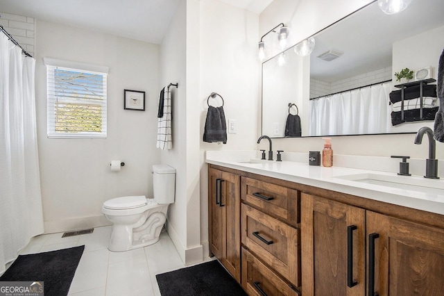 full bath featuring toilet, a sink, and visible vents