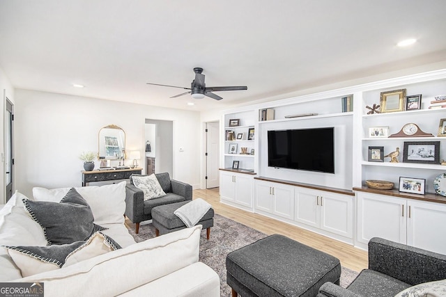 living area with light wood-type flooring, ceiling fan, and recessed lighting