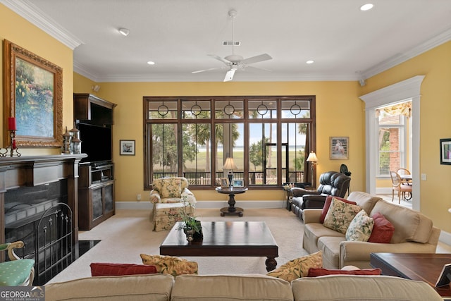 living room featuring light carpet, ornamental molding, a fireplace with flush hearth, and visible vents