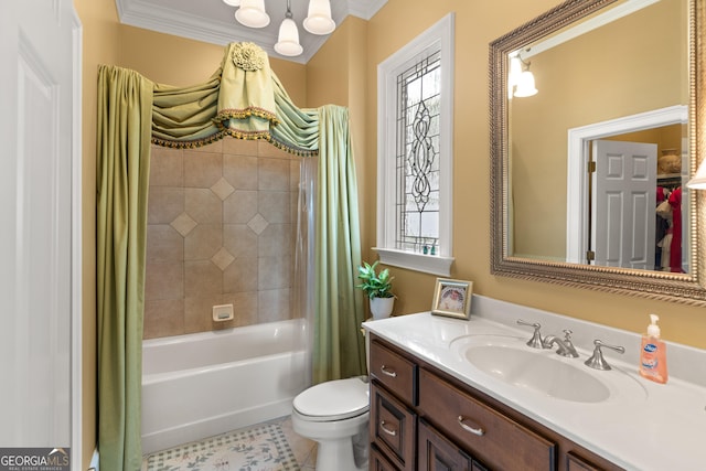 bathroom featuring toilet, plenty of natural light, crown molding, and vanity