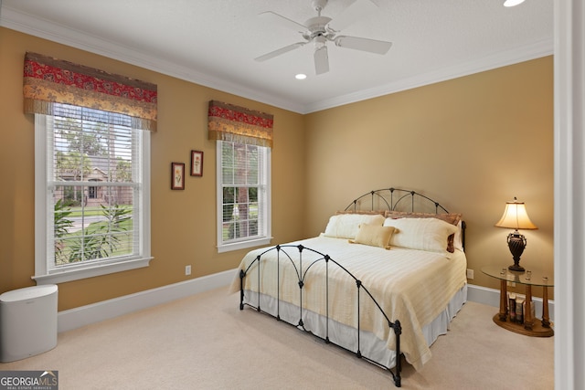 bedroom featuring carpet floors, multiple windows, baseboards, and crown molding