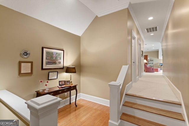 stairs with baseboards, visible vents, ornamental molding, wood finished floors, and recessed lighting