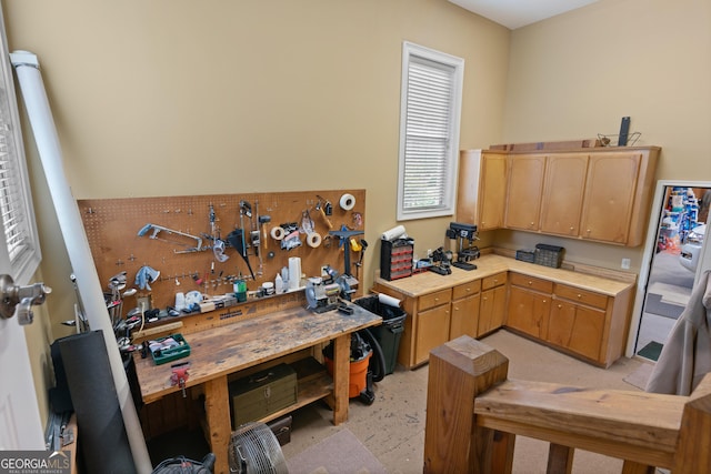 kitchen with light countertops and light brown cabinets