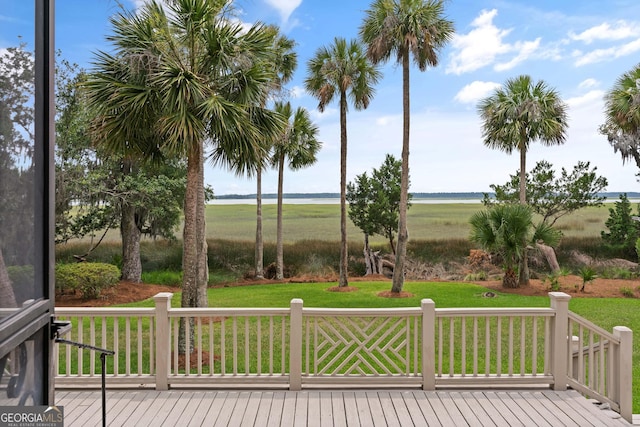 wooden deck featuring a yard