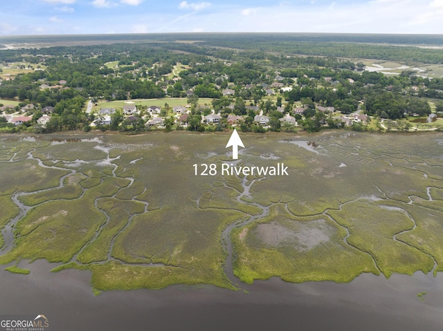 drone / aerial view with a water view