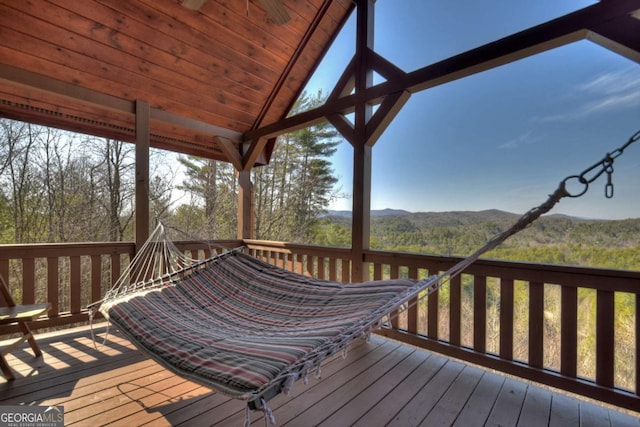 wooden deck with a mountain view