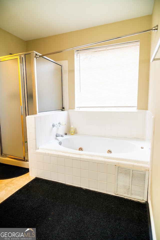 full bathroom featuring visible vents, a healthy amount of sunlight, a shower stall, and a whirlpool tub