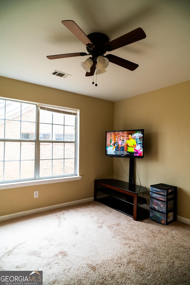 interior space with carpet flooring, visible vents, and baseboards