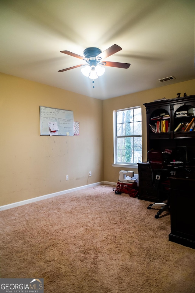 home office featuring ceiling fan, carpet floors, visible vents, and baseboards