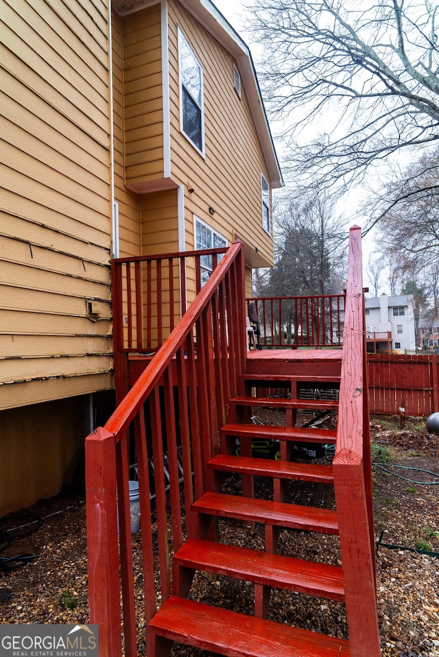 exterior space with fence and stairway