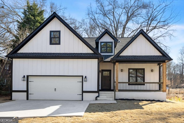 modern inspired farmhouse featuring a garage, covered porch, concrete driveway, roof with shingles, and board and batten siding