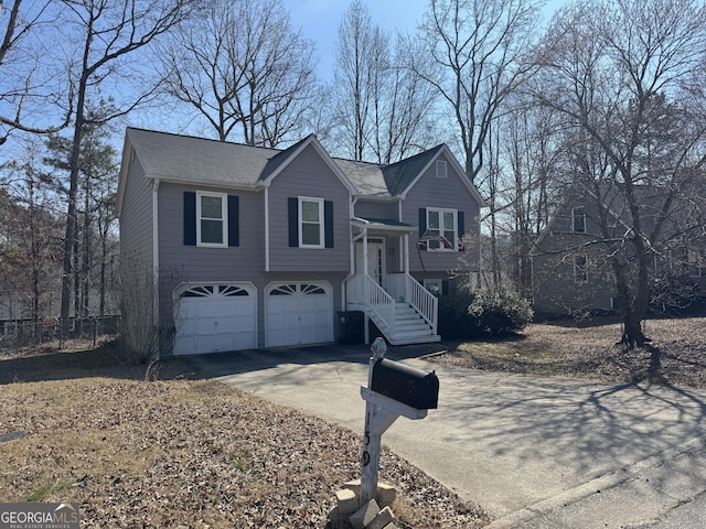 split foyer home featuring driveway and an attached garage