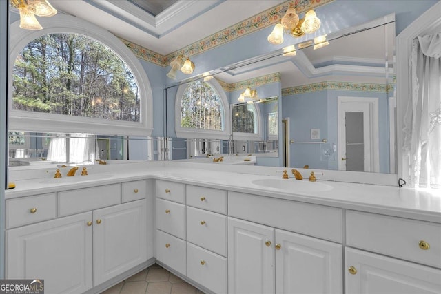 bathroom with ornamental molding and vanity