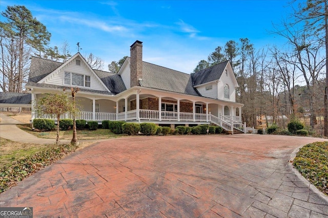 exterior space with a porch and a chimney