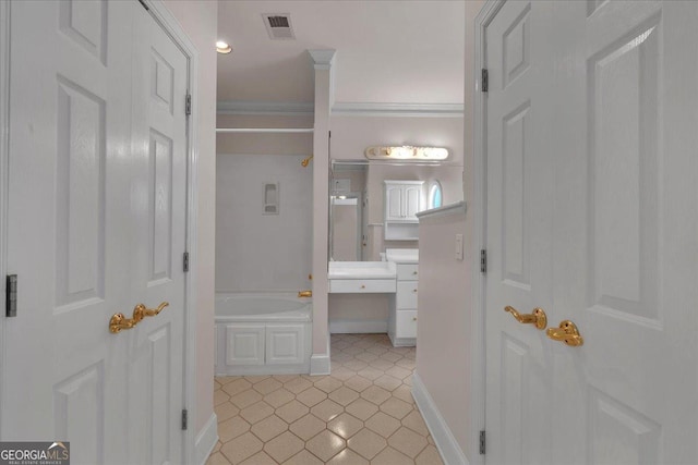 full bathroom featuring a garden tub, visible vents, ornamental molding, vanity, and baseboards