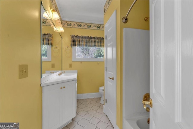 full bathroom featuring tile patterned flooring, toilet, vanity, baseboards, and washtub / shower combination