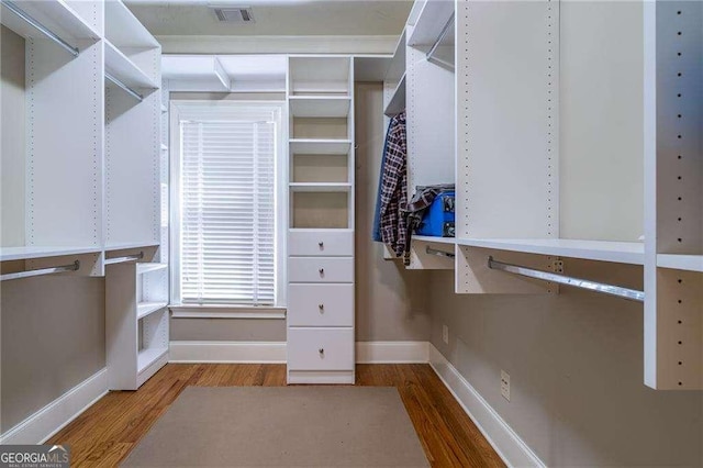 spacious closet with visible vents and wood finished floors