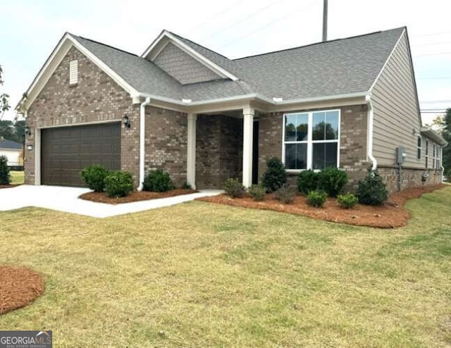 craftsman inspired home with a garage, concrete driveway, brick siding, and a front yard