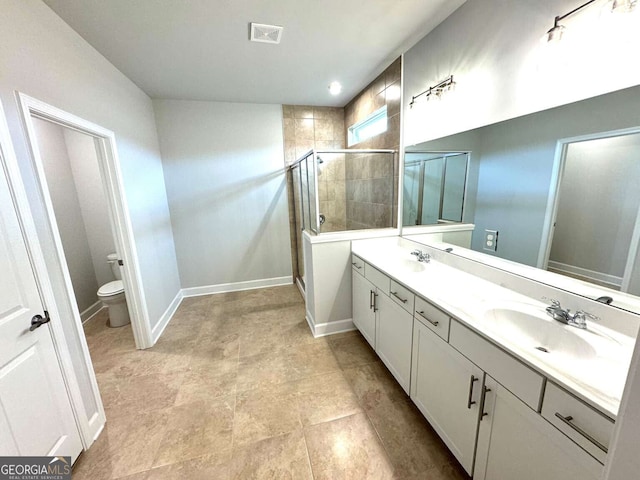 full bathroom with toilet, a shower stall, visible vents, and a sink