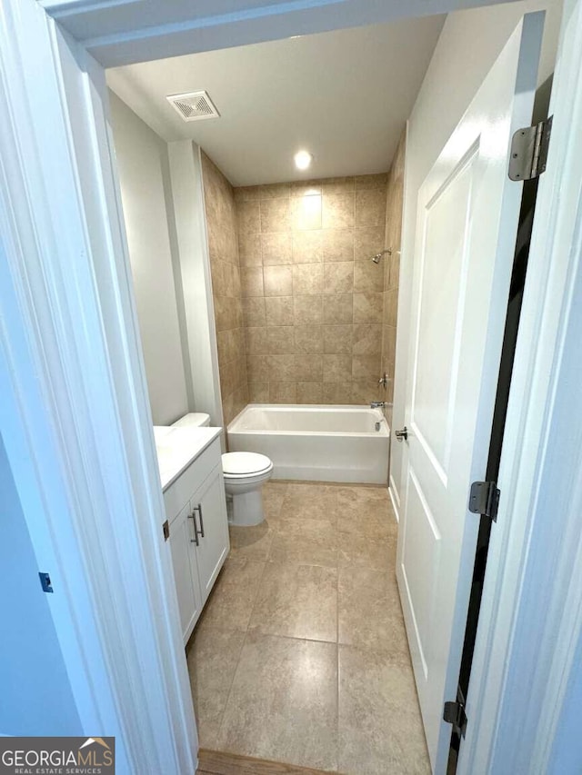 full bathroom with tile patterned flooring, toilet, vanity, visible vents, and shower / bathing tub combination