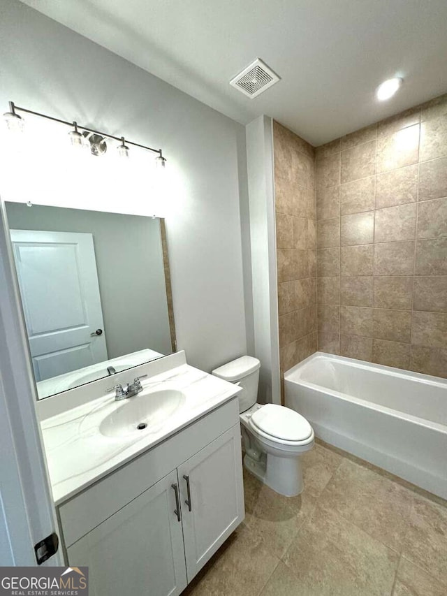 full bathroom featuring shower / washtub combination, visible vents, vanity, and toilet