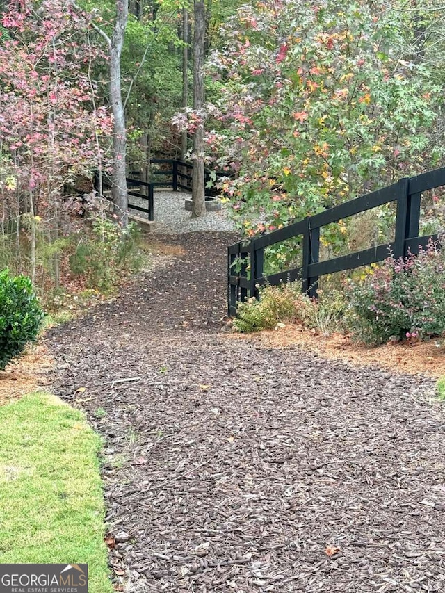 view of gate featuring fence