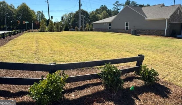 view of yard featuring central AC unit