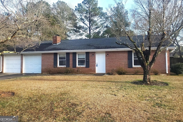 ranch-style house featuring brick siding, an attached garage, and a front lawn