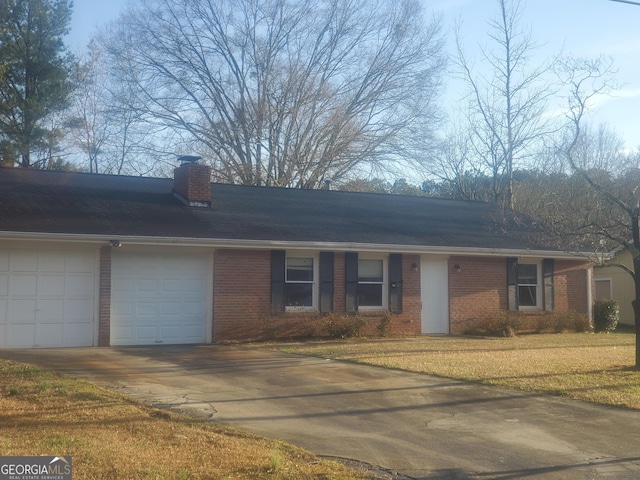 455 Sweet Water Trl SE, Conyers, GA 30094 - ranch-style house with brick siding, a front lawn, concrete driveway, and a garage