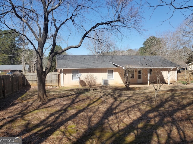 back of property with a patio area, fence, and central AC