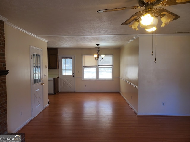 unfurnished dining area with baseboards, visible vents, crown molding, and wood finished floors