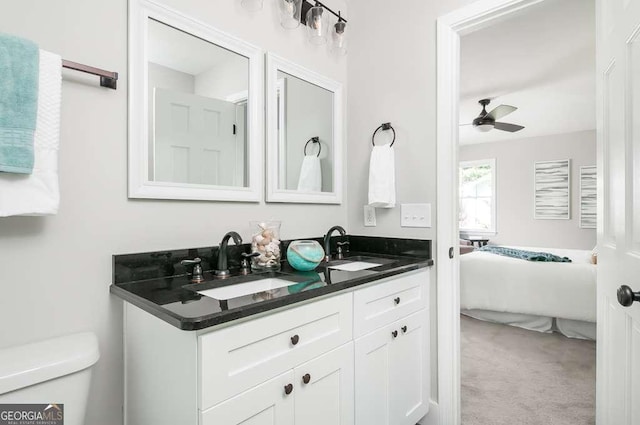 full bathroom featuring connected bathroom, toilet, a ceiling fan, and a sink