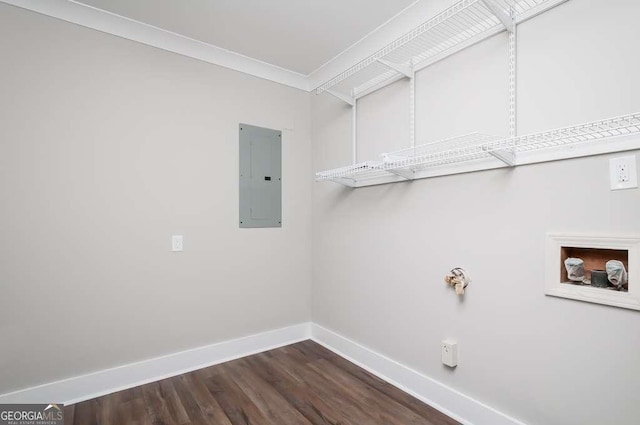 clothes washing area featuring baseboards, laundry area, electric panel, dark wood-style flooring, and crown molding