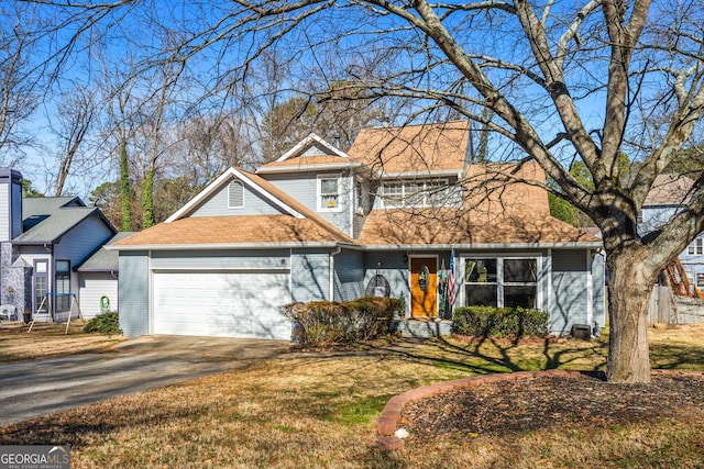 view of front of house featuring a front lawn, brick siding, driveway, and an attached garage