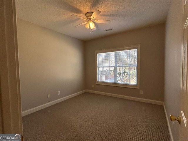 unfurnished room featuring a ceiling fan, carpet floors, a textured ceiling, and baseboards