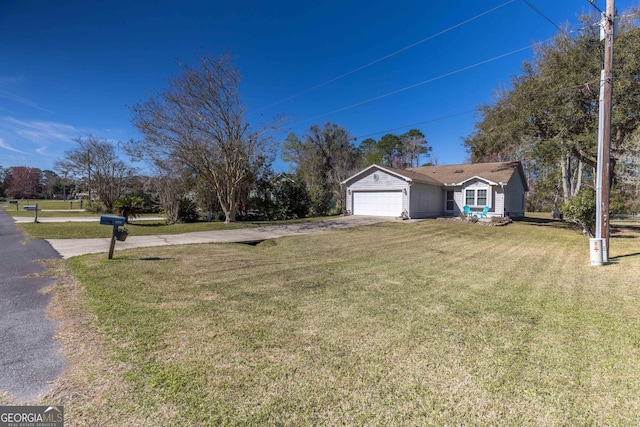 view of front of property with a garage, driveway, and a front lawn