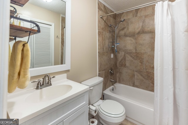 full bath featuring toilet, shower / bath combo with shower curtain, a textured ceiling, and vanity