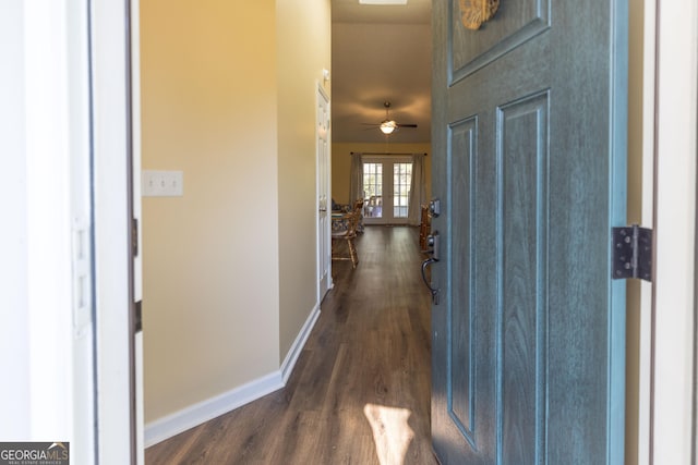 entryway featuring french doors, dark wood-style flooring, and baseboards