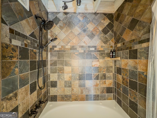 bathroom featuring washtub / shower combination