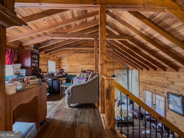 interior space with wood-type flooring, wood ceiling, vaulted ceiling with beams, an upstairs landing, and wood walls