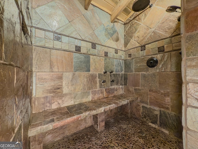 full bathroom featuring tiled shower