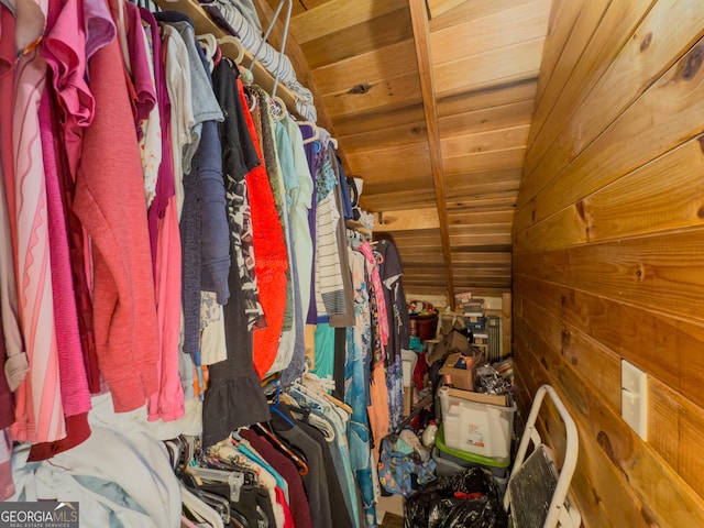 walk in closet with vaulted ceiling