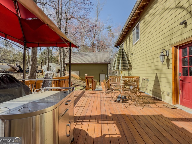 wooden deck featuring outdoor dining space